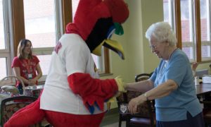 Fredbird Interacting with Resident, Assisted Living